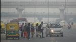 New Delhi, India - Nov. 16, 2021: People are seen wearing warm clothes as the temperature has seen a drop, on NH24, and the AQI is back in the severe category in New Delhi, India, on Tuesday, November 16, 2021. (Photo by Raj K Raj / Hindustan Times) (Hindustan Times)