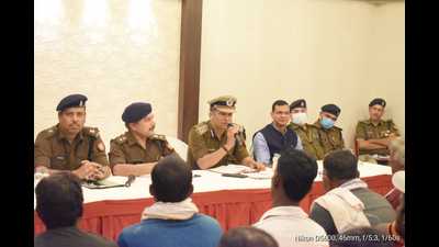 Additional commissioner of police (headquarters and crime) Subhash Chandra Dubey holding a meeting with boatmen. (-HT photo)