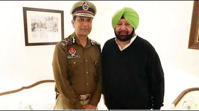 Dinkar Gupta with then chief minister Capt Amarinder Singh after his appointment as the Punjab Police chief in Chandigarh in 2019. (HT file photo) Dinkar Gupta with then chief minister Capt Amarinder Singh after his appointment as the Punjab Police chief in Chandigarh in 2019. (HT file photo)