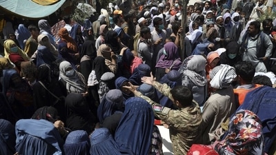 Internally displaced Afghans from northern provinces, who fled their home due to fighting between the Taliban and Afghan security personnel, wait to receive free food in a public park in Kabul, Afghanistan. (AP | Representational Image)