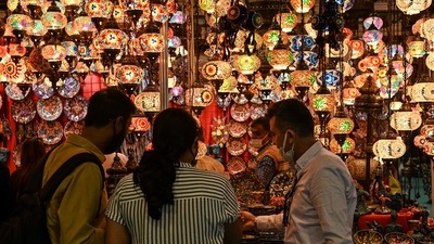 Visitors select a lamp at a Turkish stall during the India International Trade Fair (IITF) in New Delhi on November 14. (AFP) Visitors select a lamp at a Turkish stall during the India International Trade Fair (IITF) in New Delhi on November 14. (AFP)