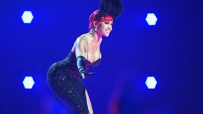 Rapper Saweetie performs on stage during the MTV Europe Music Awards at the Laszlo Papp Budapest Sports Arena in Budapest, Hungary on November 14 donning a stunning black low neckline shimmery dress. (AFP)