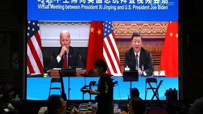 A screen shows Chinese President Xi Jinping attending a virtual meeting with US President Joe Biden via video link, at a restaurant in Beijing, China. (REUTERS)