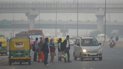 New Delhi, India - Nov. 16, 2021: People are seen wearing warm clothes as the temperature has seen a drop, on NH24, and the AQI is back in the severe category in New Delhi, India, on Tuesday, November 16, 2021. (Photo by Raj K Raj / Hindustan Times) (Hindustan Times) New Delhi, India - Nov. 16, 2021: People are seen wearing warm clothes as the temperature has seen a drop, on NH24, and the AQI is back in the severe category in New Delhi, India, on Tuesday, November 16, 2021. (Photo by Raj K Raj / Hindustan Times) (Hindustan Times)