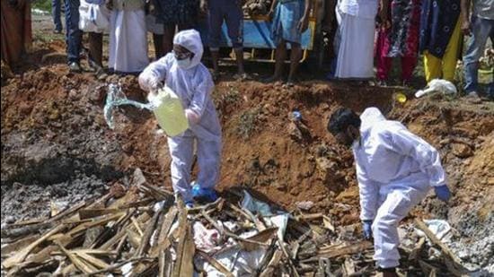 A file photo of health workers preparing to light a fire after culling ducks following the detection of the H5N8 strain of bird flu among domestic birds in Alappuzha district, Kerala. In Rajasthan, bird flu has killed 300 migratory demoiselle cranes in 10 days. (AP/File)