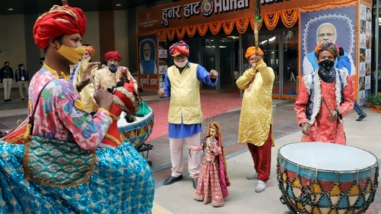 Artists perform a puppet show during the inauguration of the 33rd Hunar Haat at the 40th India International Trade Fair at Pragati Maidan in New Delhi.(ANI)