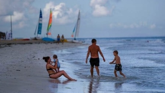 Cuba reopened schools and its borders to international tourism on Monday as opposition groups urged supporters to protest for greater political freedoms, setting up a tense showdown between the government and its critics on the Caribbean island. (AP Photo/Ramon Espinosa)