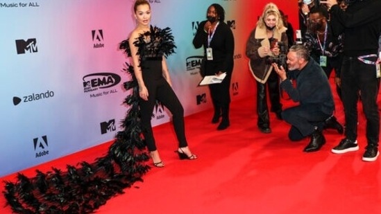 Rita Ora stuns at the European MTV Awards in black veil fur top and high-rise pants.(AP)
