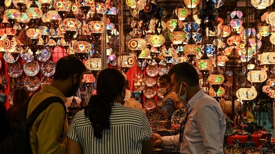 Visitors select a lamp at a Turkish stall during the India International Trade Fair (IITF) in New Delhi on November 14.(AFP)