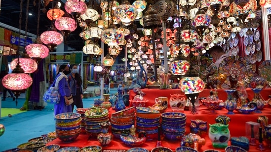 A stall at the India International Trade Fair at Pragati Maidan complex in New Delhi displays beautifully handcrafted lamps and bowls.(PTI)