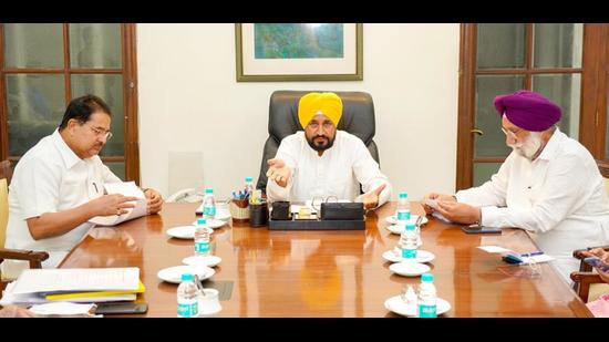 Punjab chief minister Charanjit Singh Channi chaired a cabinet meeting in Chandigarh on Tuesday. Earlier, he visited Dharowali, the ancestral village of deputy chief minister Sukhjinder Singh Randhawa (right) in Gurdaspur district. (HT file photo)