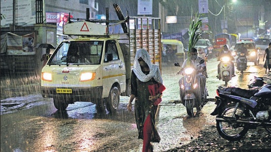 Jambhulwadi road in Pune experienced a sudden downpour on Tuesday evening. As temperatures across Pune city fluctuate with a difference of at least 10 degrees Centigrade between maximum and minimum, doctors have sounded the change of season “viral infection” alarm. (RAVINDRA JOSHI/HT)