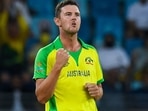 Australia's Josh Hazlewood celebrates after dismissing New Zealand's Daryl Mitchell (not pictured) during the ICC men�s Twenty20 World Cup final match between Australia and New Zealand at the Dubai International Cricket Stadium in Dubai on November 14, 2021. (Photo by INDRANIL MUKHERJEE / AFP)(AFP) Australia's Josh Hazlewood celebrates after dismissing New Zealand's Daryl Mitchell (not pictured) during the ICC men�s Twenty20 World Cup final match between Australia and New Zealand at the Dubai International Cricket Stadium in Dubai on November 14, 2021. (Photo by INDRANIL MUKHERJEE / AFP)(AFP)