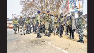 Security personnel examine the site of a grenade blast, hurled by militants, at Palhalan area of Baramulla district of North Kashmir, Wednesday. (PTI) Security personnel examine the site of a grenade blast, hurled by militants, at Palhalan area of Baramulla district of North Kashmir, Wednesday. (PTI)