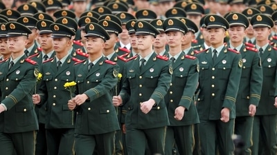Members of China’s People’s Liberation Army (PLA) prepare to lay flowers at the Monument to the People’s Heroes during a ceremony on Tiananmen Square to mark Martyrs Day, in Beijing, China on September 30, 2021. The Chinese military has conducted “major operations related to border defence” and strengthened training under combat conditions to build a modern armed force, the ruling Communist Party of China has said. (REUTERS) Members of China’s People’s Liberation Army (PLA) prepare to lay flowers at the Monument to the People’s Heroes during a ceremony on Tiananmen Square to mark Martyrs Day, in Beijing, China on September 30, 2021. The Chinese military has conducted “major operations related to border defence” and strengthened training under combat conditions to build a modern armed force, the ruling Communist Party of China has said. (REUTERS)
