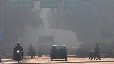 A motorcyclist drives on the wrong side of the road amidst morning haze and toxic smog in New Delhi. (AP) A motorcyclist drives on the wrong side of the road amidst morning haze and toxic smog in New Delhi. (AP)