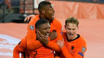 Netherlands' Steven Bergwijn is congratulated by teammates after scoring his team's first goal during the World Cup 2022 group G qualifying soccer match (AP) Netherlands' Steven Bergwijn is congratulated by teammates after scoring his team's first goal during the World Cup 2022 group G qualifying soccer match (AP)