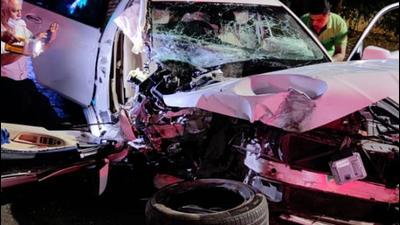 Mangled remains of BMW car after accident. The vehicle dashed the road divider at Mhatre bridge in Pune on Wednesday night. Two occupants of the car broke the windshield and came out of the vehicle, while the third passenger, who was injured, had to be rescued by fire brigade. (HT)