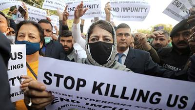 Peoples Democratic Party chief Mehbooba Mufti with her supporters holding placards during a protest over alleged killing of civilians in Hyderpora encounter, in Jammu on Wednesday. (ANI) Peoples Democratic Party chief Mehbooba Mufti with her supporters holding placards during a protest over alleged killing of civilians in Hyderpora encounter, in Jammu on Wednesday. (ANI)