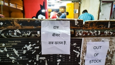 Notices read 'Out of Stock' at a government-run liquor shop as a new excise policy comes into effect, in New Delhi. (PTI) Notices read 'Out of Stock' at a government-run liquor shop as a new excise policy comes into effect, in New Delhi. (PTI)