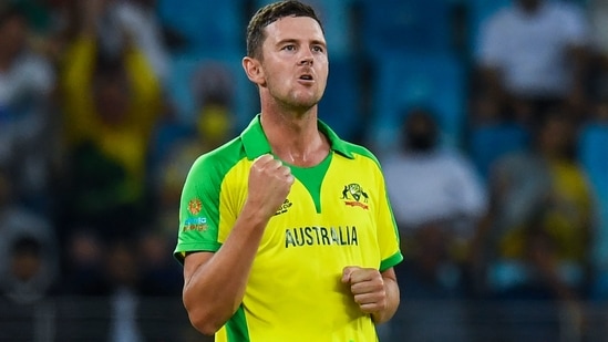 Australia's Josh Hazlewood celebrates after dismissing New Zealand's Daryl Mitchell (not pictured) during the ICC men�s Twenty20 World Cup final match between Australia and New Zealand at the Dubai International Cricket Stadium in Dubai on November 14, 2021. (Photo by INDRANIL MUKHERJEE / AFP)(AFP)