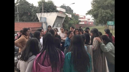 PAU students gathered outside girls’ hostel number 11 on Wednesday. (HT photo)