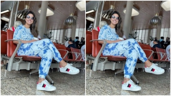Hina accessorised her airport look with tinted shades and a pair of white sneakers.(Instagram/@realhinakhan)