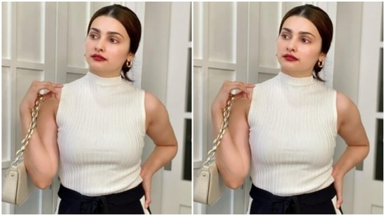 Prachi teamed a white top with a black pair of joggers.(Instagram/@prachidesai)