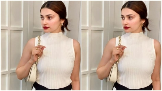 The sleeveless white top came with a high neck detail.(Instagram/@prachidesai)