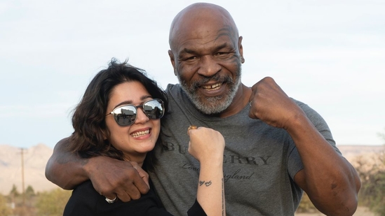 Actor and producer Charmy Kaur poses with Mike Tyson.(Instagram)