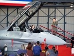 Taiwan's President Tsai Ing-wen poses for photos from the cockpit during a ceremony to commission into service 64 upgraded F-16V fighter jets at an Air Force base in Chiayi in southwestern Taiwan. Taiwan's President Tsai Ing-wen poses for photos from the cockpit during a ceremony to commission into service 64 upgraded F-16V fighter jets at an Air Force base in Chiayi in southwestern Taiwan.