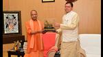 Uttar Pradesh chief minister Yogi Adityanath being felicitated with a miniature model of a temple by Uttarakhand chief minister Pushkar Singh Dhami, in Lucknow on Thursday. (ANI Photo) Uttar Pradesh chief minister Yogi Adityanath being felicitated with a miniature model of a temple by Uttarakhand chief minister Pushkar Singh Dhami, in Lucknow on Thursday. (ANI Photo)