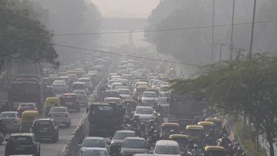 Commuters drive amid morning haze and smog in New Delhi on Wednesday. The Capital’s air quality was ‘very poor’ on Thursday as well. (AP)