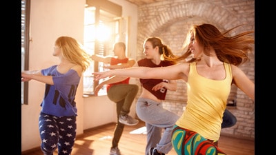 Young Zumba dancers dancing together in dancing studio (Shutterstock) Young Zumba dancers dancing together in dancing studio (Shutterstock)
