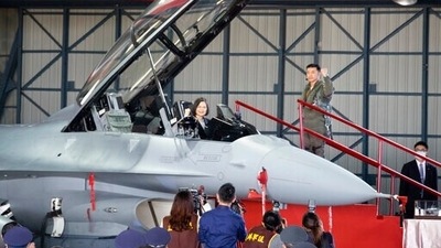 Taiwan's President Tsai Ing-wen poses for photos from the cockpit during a ceremony to commission into service 64 upgraded F-16V fighter jets at an Air Force base in Chiayi in southwestern Taiwan. (AP) Taiwan's President Tsai Ing-wen poses for photos from the cockpit during a ceremony to commission into service 64 upgraded F-16V fighter jets at an Air Force base in Chiayi in southwestern Taiwan. (AP)
