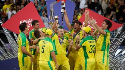 Australia's Matthew Wade celebrates with the trophy and teammates after winning the ICC Men's T20 World Cup (REUTERS)