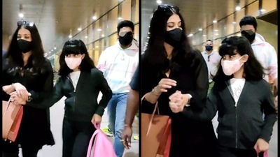 Abhishek Bachchan, Aishwarya Rai and Aaradhya were photographed at the Mumbai airport post their trip. (Varinder Chawla) Abhishek Bachchan, Aishwarya Rai and Aaradhya were photographed at the Mumbai airport post their trip. (Varinder Chawla)