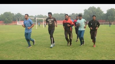 Runners practicing in MMM Stadium on the eve of the Indira Marathon in Prayagraj on Thursday. (HT Photo)