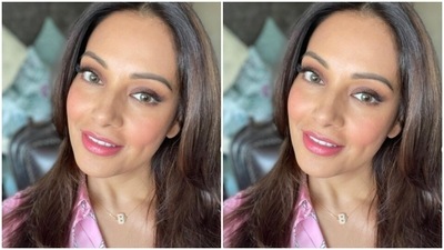 Bipasha chose a pink and white silk shirt for the photoshoot. (Instagram/@bipashabasu)