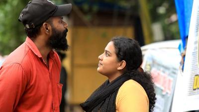 Former SFI leader Anupama S Chandran with her husband Ajith at a stand-in protest outside the office of Kerala’s child welfare council to seek action against officials who colluded with her father to give up her infant for adoption. (HT Photo/Vivek R Nair) Former SFI leader Anupama S Chandran with her husband Ajith at a stand-in protest outside the office of Kerala’s child welfare council to seek action against officials who colluded with her father to give up her infant for adoption. (HT Photo/Vivek R Nair)