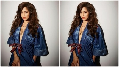 Assisted by hair stylist and makeup artist Tanvi Marathe, Nushrratt opted for a no makeup look with the attire. She just added bright red lipstick and was fashion-ready. (Instagram/@nidhijeswani) Assisted by hair stylist and makeup artist Tanvi Marathe, Nushrratt opted for a no makeup look with the attire. She just added bright red lipstick and was fashion-ready. (Instagram/@nidhijeswani)