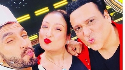 Govinda and Sunita Ahuja pose with Ranveer Singh.