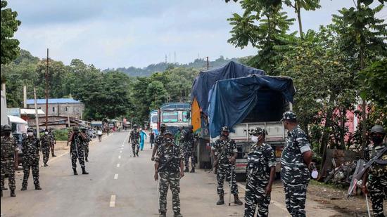 Central para-military forces standing guard at the national highway in Lailapur area near Assam-Mizoram border in August after the two states agreed to resolve their differences peacefully (AFP)