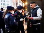 Austrian Chancellor Alexander Schallenberg said on Friday that the lockdown will start on Monday and initially last for 10 days. In picture - Police check vaccination status on a Christmas market in Vienna, Austria.(AP) Austrian Chancellor Alexander Schallenberg said on Friday that the lockdown will start on Monday and initially last for 10 days. In picture - Police check vaccination status on a Christmas market in Vienna, Austria.(AP)