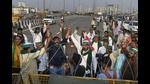 Farmers raise slogans as police remove barricades from the farmers' protest site, Ghazipur, New Delhi, October 29, 2021 (PTI) Farmers raise slogans as police remove barricades from the farmers' protest site, Ghazipur, New Delhi, October 29, 2021 (PTI)