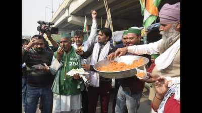 The protesting farmers celebrate PM Narendra Modi’s announcement that the three farm laws will be repealed, at the Ghazipur protest site on the Delhi-Uttar Pradesh border on Friday. (Sakib Ali/ HT) The protesting farmers celebrate PM Narendra Modi’s announcement that the three farm laws will be repealed, at the Ghazipur protest site on the Delhi-Uttar Pradesh border on Friday. (Sakib Ali/ HT)
