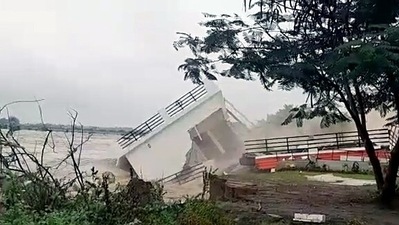 A house situated on the banks of the Palar river collapsed and was washed away, in Vellore due to heavy rains. (ANI) A house situated on the banks of the Palar river collapsed and was washed away, in Vellore due to heavy rains. (ANI)