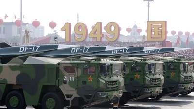 Military vehicles carrying hypersonic missiles DF-17 travel past Tiananmen Square (REUTERS)