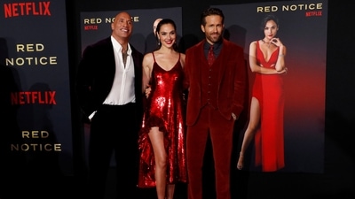 Dwayne Johnson, Gal Gadot and Ryan Reynolds featured in Red Notice. (REUTERS)