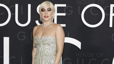 Lady Gaga opted for a bustier dress entirely embroidered with iridescent silver sequins from Pierpaolo Piccioli's Valentino Haute Couture Code Temporal collection. (AFP) Lady Gaga opted for a bustier dress entirely embroidered with iridescent silver sequins from Pierpaolo Piccioli's Valentino Haute Couture Code Temporal collection. (AFP)